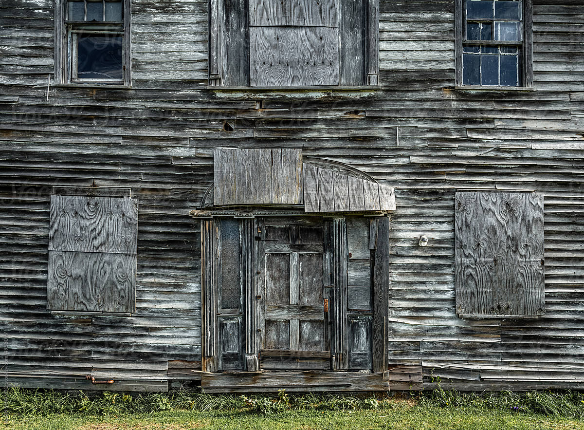 grey house facade completely made of barnboard