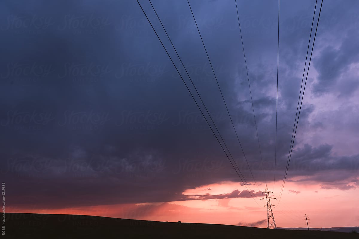 Spectacular sunset scenery with electrical power lines