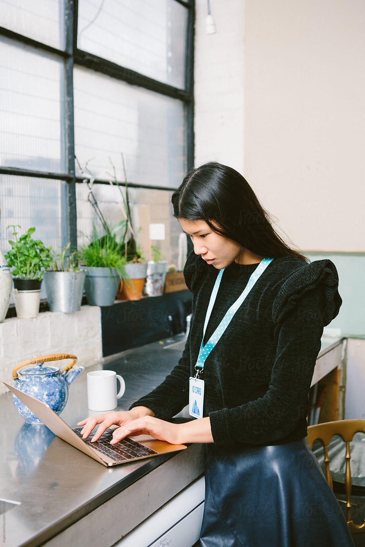 Young Asian business woman using a laptop