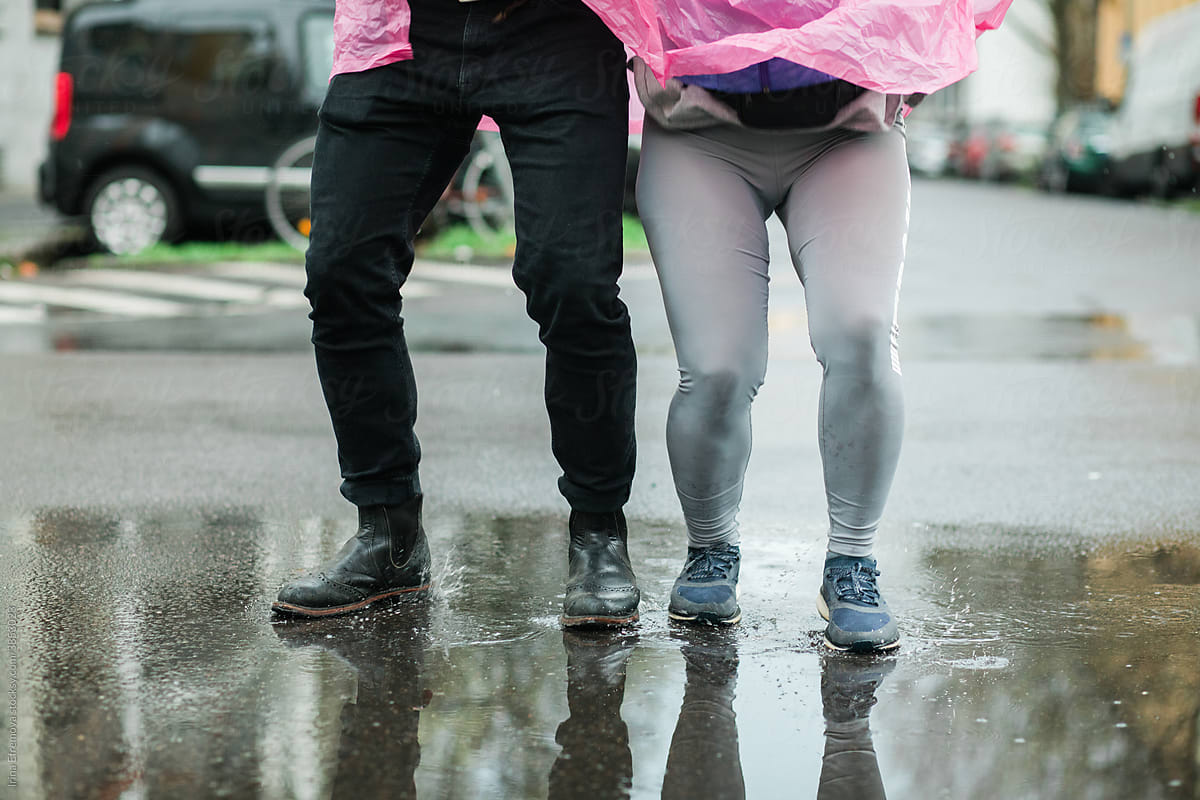 Couple having fun in a puddle