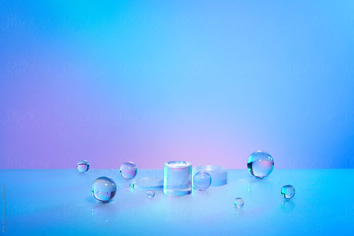Acrylic blocks and balls on colorful light background