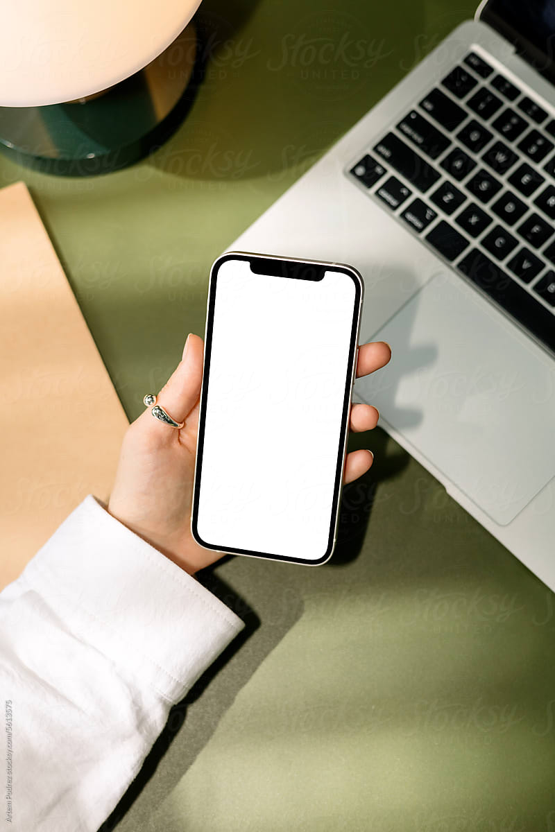 Woman With Cell Phone with a white screen at office. mockup phone