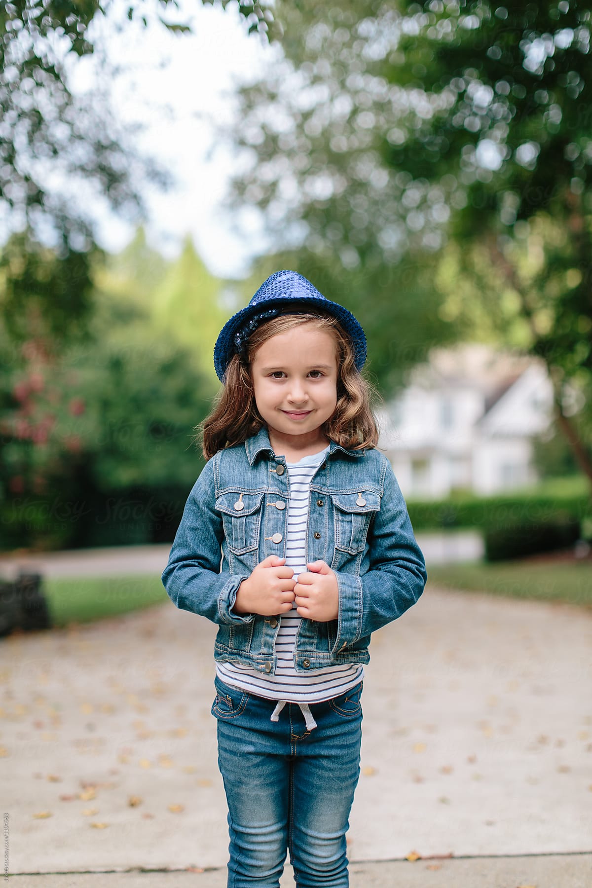 Cute Young Girl In A Denim Jacket And A Fedora By Stocksy Contributor 