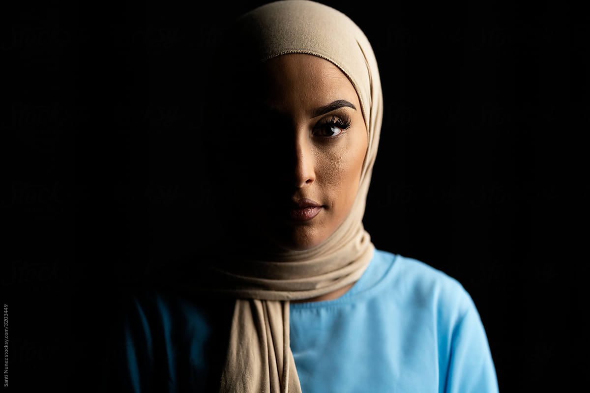 Portrait of Muslim Woman Over Black Background