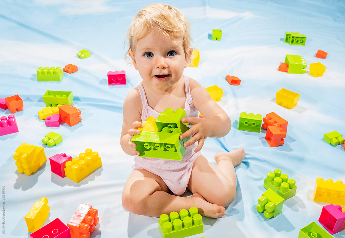 Happy child playing with blocks.