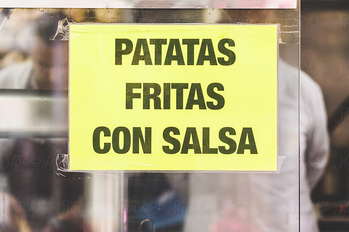 Yellow Spanish announcement on window