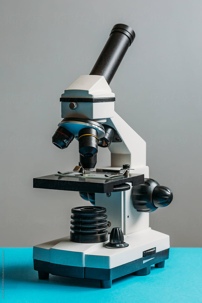 Small microscope on a blue table