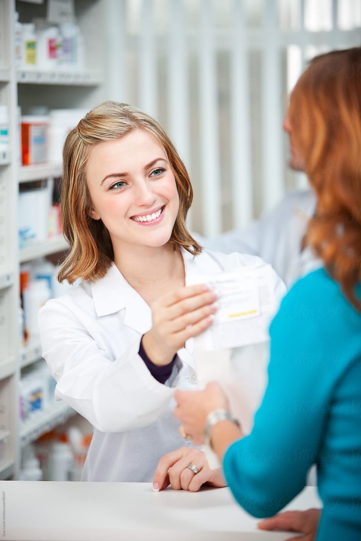 Pharmacy: Handing a Prescription to the Customer