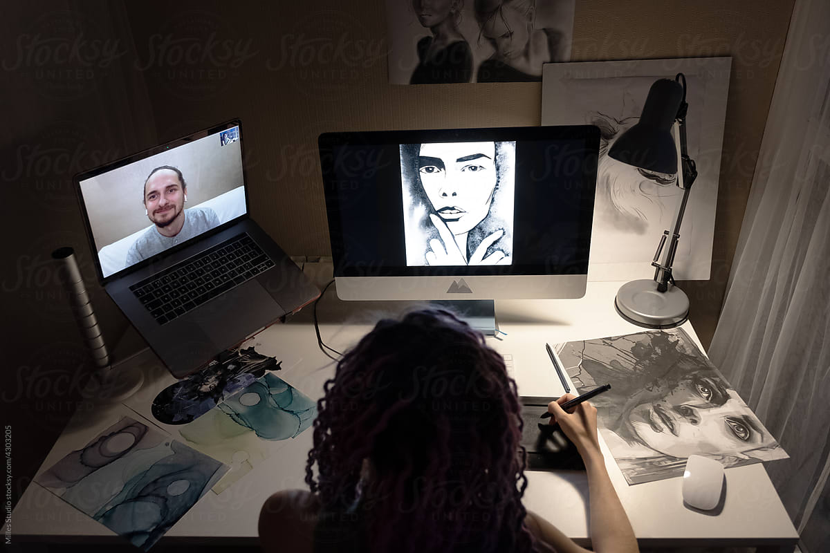 Woman making video call and drawing at night