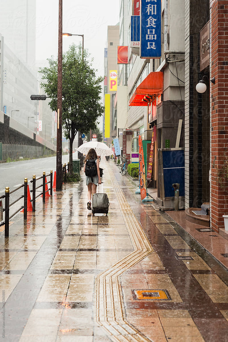 tourist walking in the rain