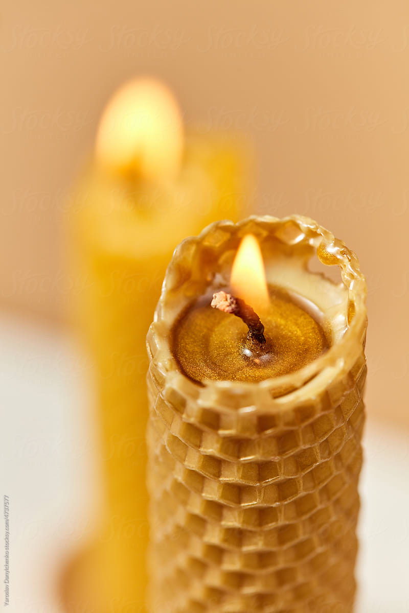 Beeswax candle with cell pattern, close up.