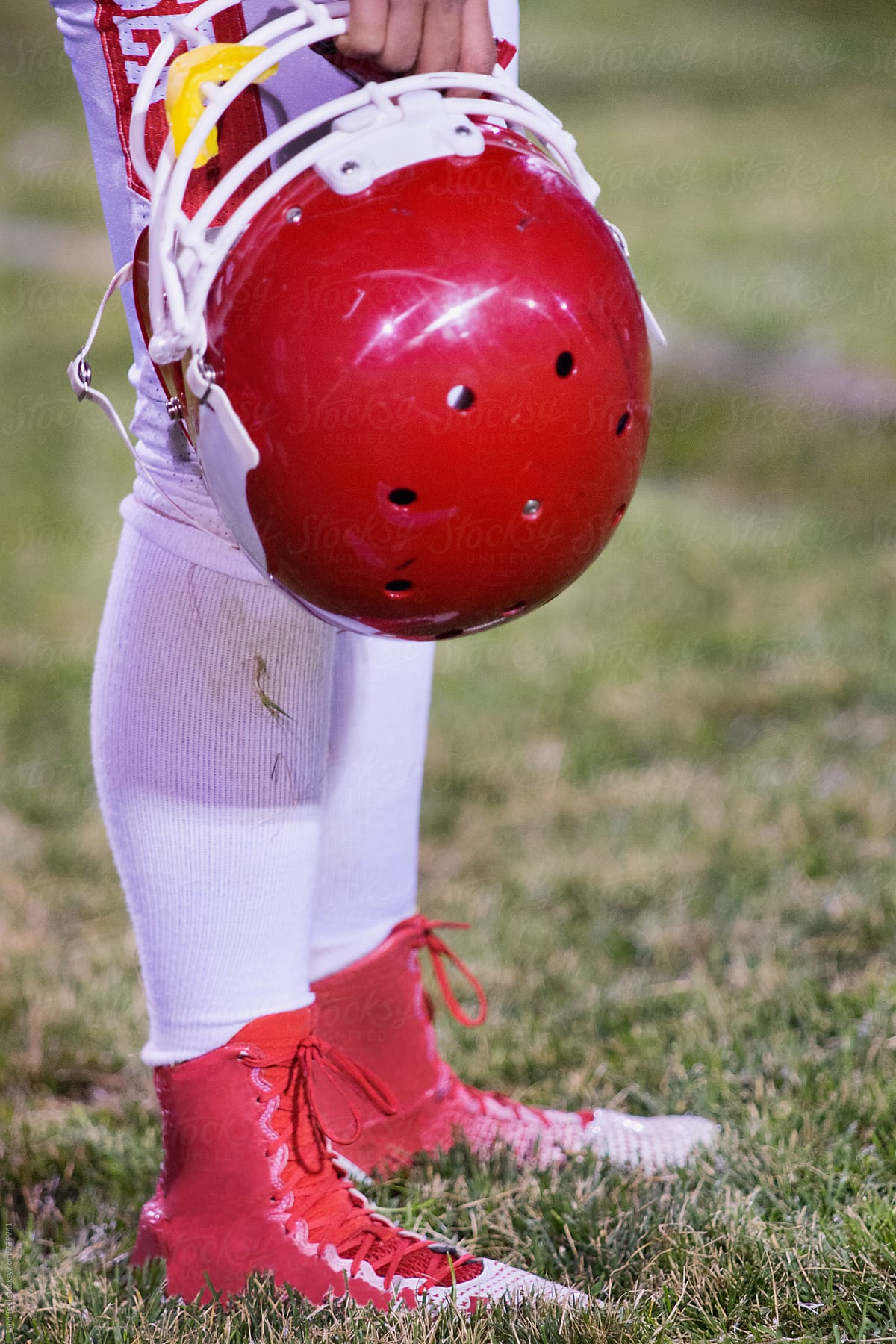 football player holding helmet