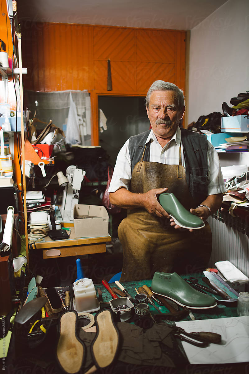 Portrait Of Senior Shoemaker In His Workshop