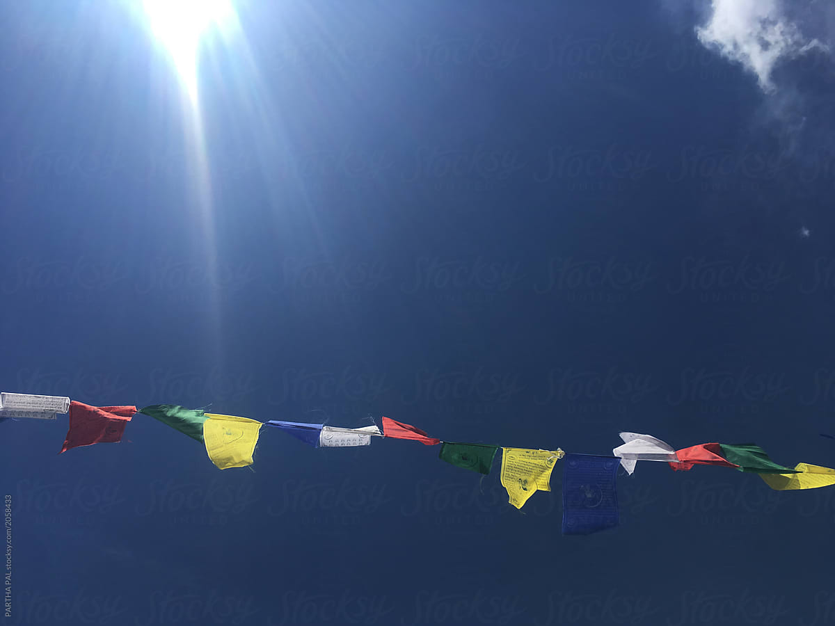 Holy flag of buddhist religion with blue sky at backdrop