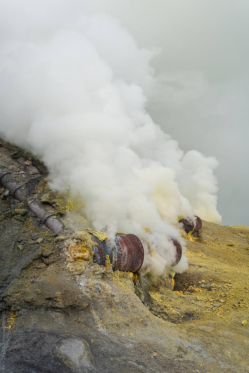 Sulfur open mine in an active volcano crater, toxic gas and ore