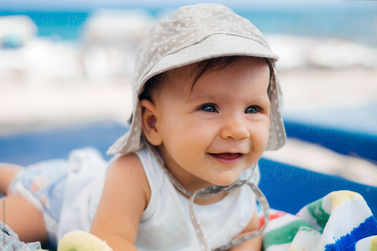 "Baby At The Beach" by Stocksy Contributor "Mosuno" - Stocksy