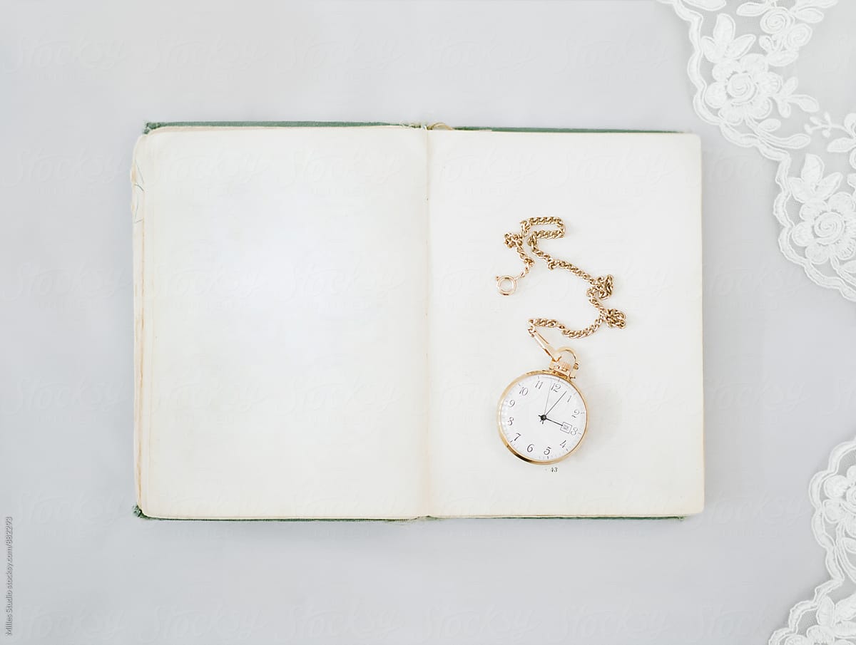 Golden watches on book