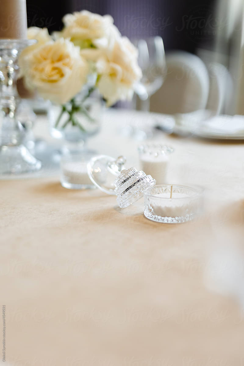 Decorative candles. Rose bouquet. Wedding reception. Festive table