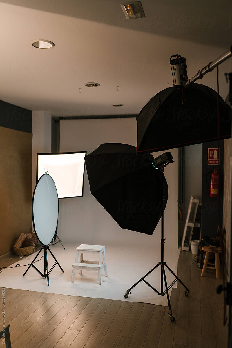 Photo studio interior with equipment and backdrop