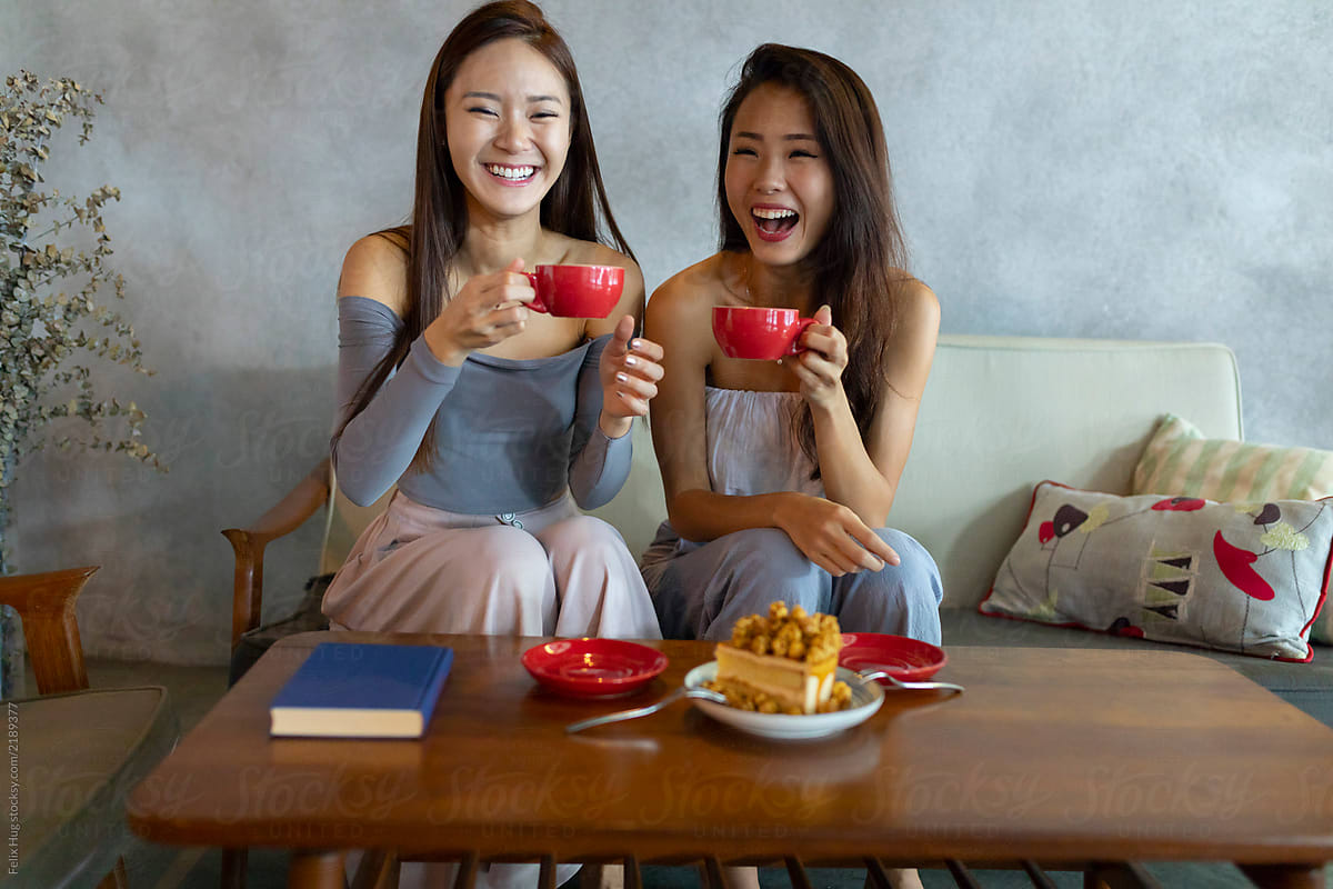 female asian friends having coffee