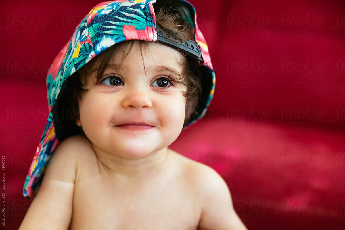 Beautiful child in tropical cap