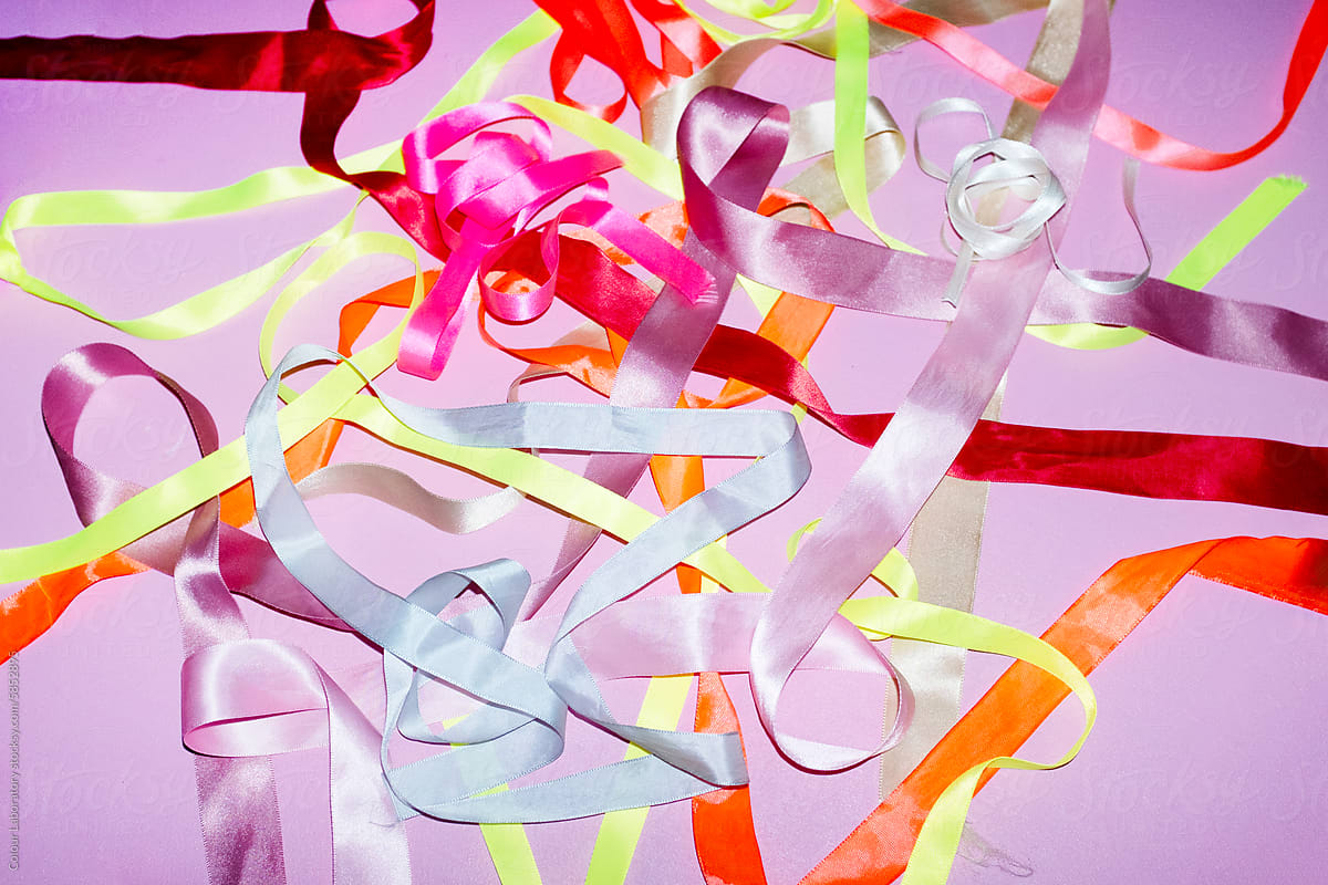 Colourful bright neon and pastel silk ribbons with hard direct flash