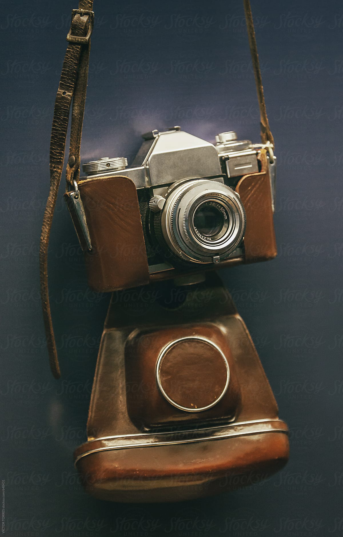 Retro Camera Hanged on a Blue Wall