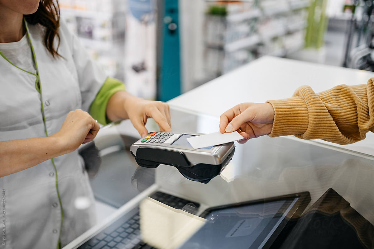 client paying with a contactless card at a pharmacy