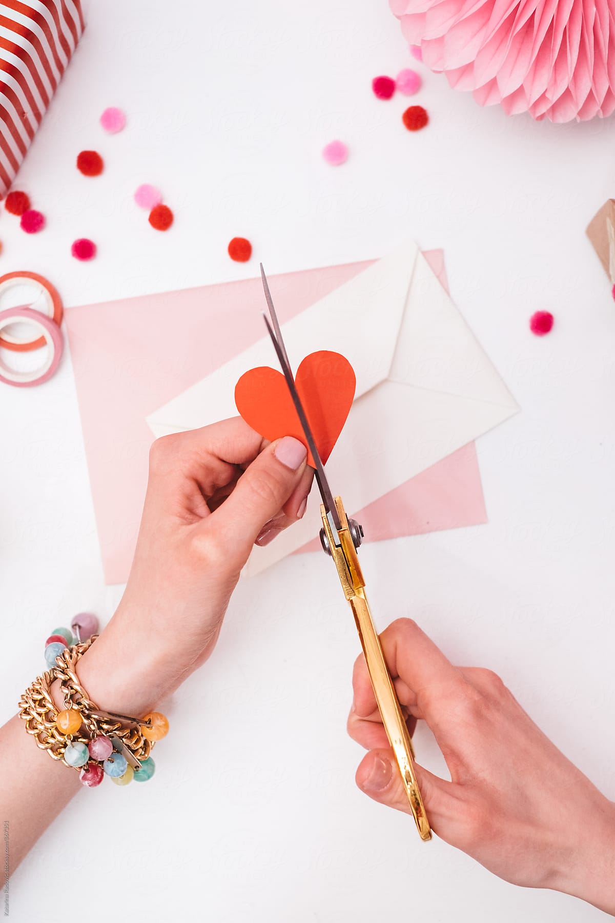 Woman Cutting Valentine's Heart Into Half