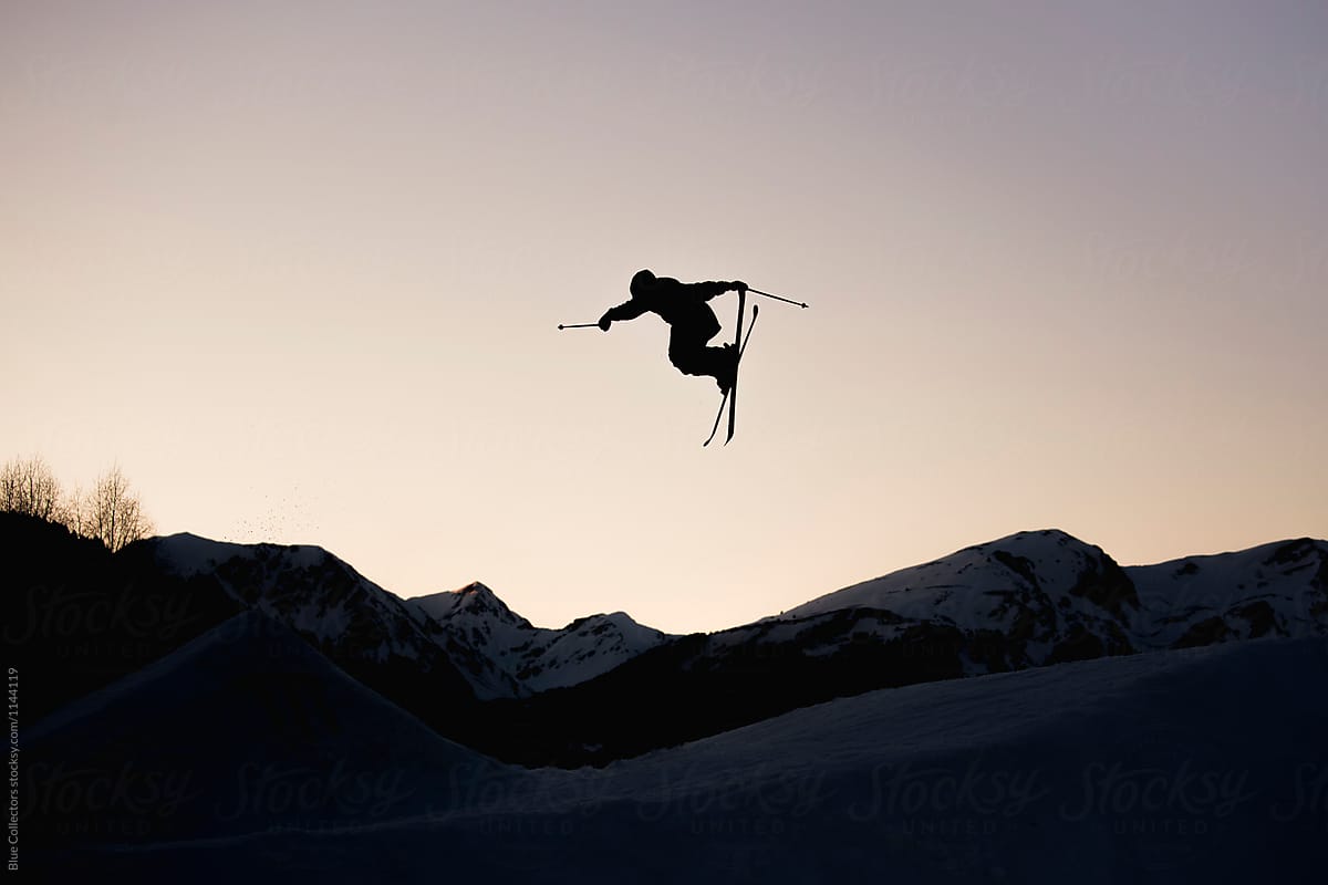Silhouette Of Skier In Mid Air From The Big Jump Freestyle At Sunset By Blue Collectors Silhouette Skier Stocksy United
