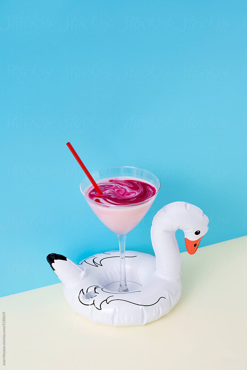 swim ring in the shape of a duck with a cocktail