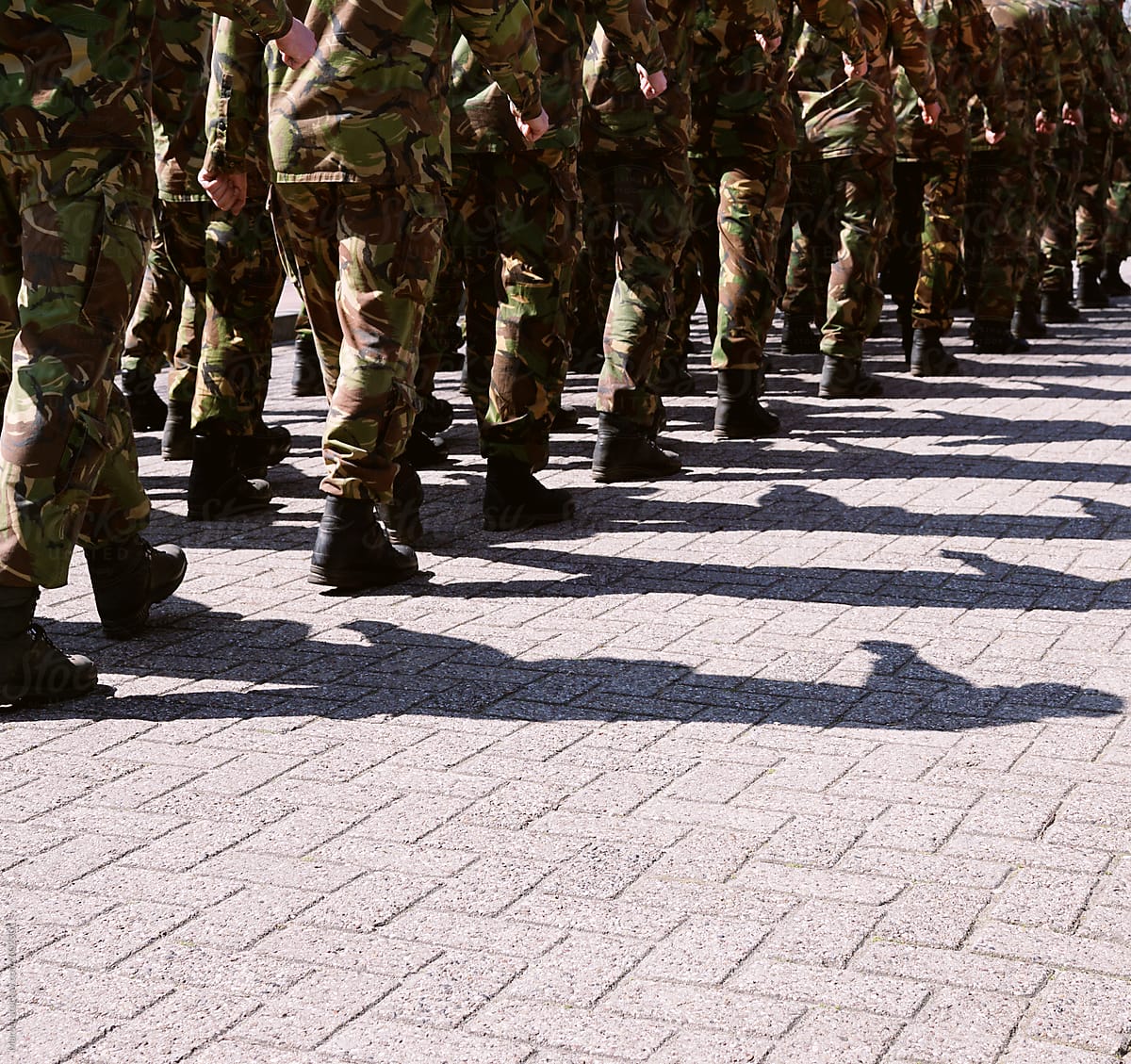 marching soldiers and their shadows