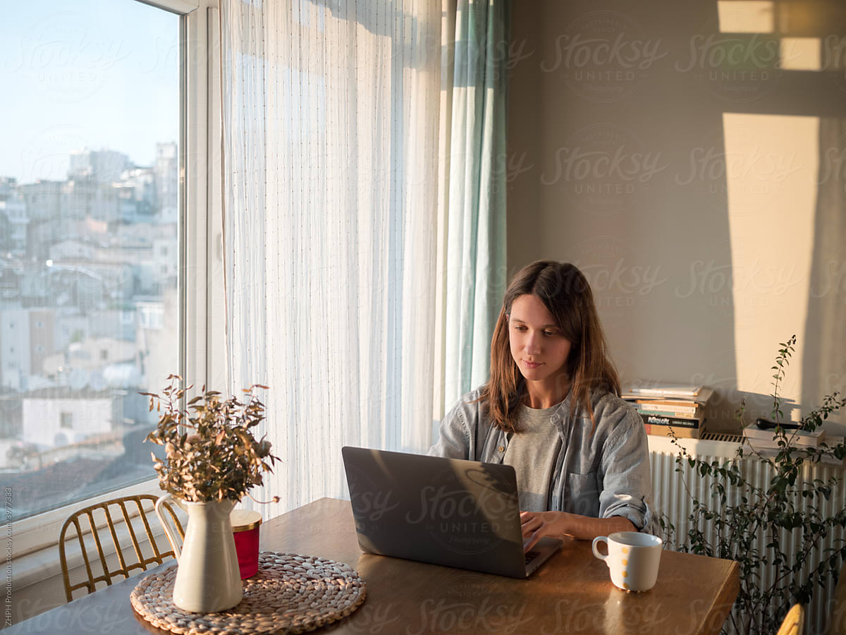 Woman working on laptop from home
