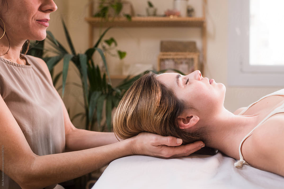 Alternative therapist during neck massage