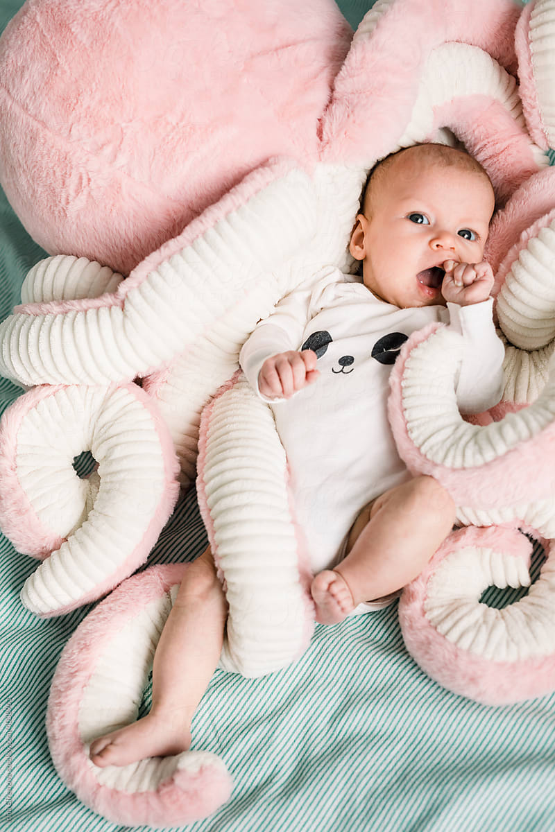 Baby in a plush octopus