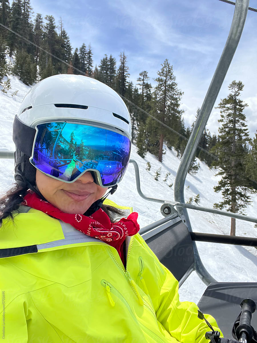 Real selfie of woman sitting on ski lift