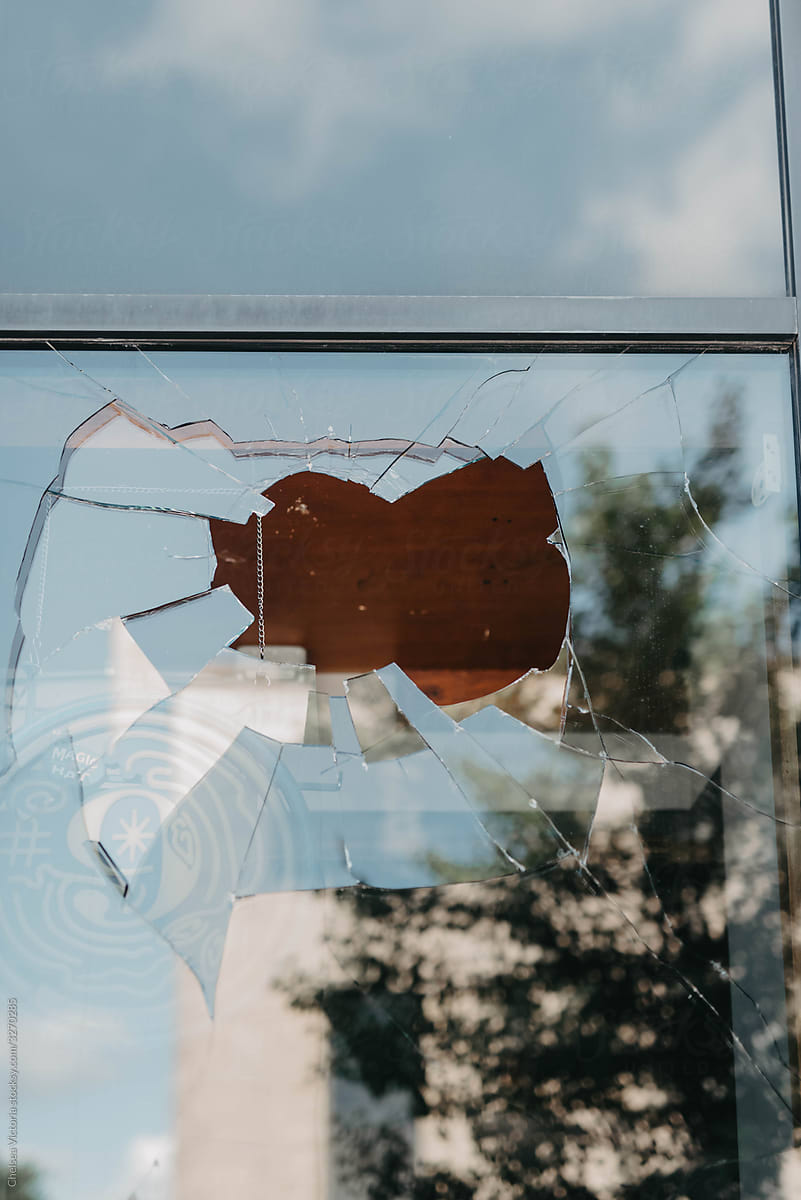 A smashed window from political protest