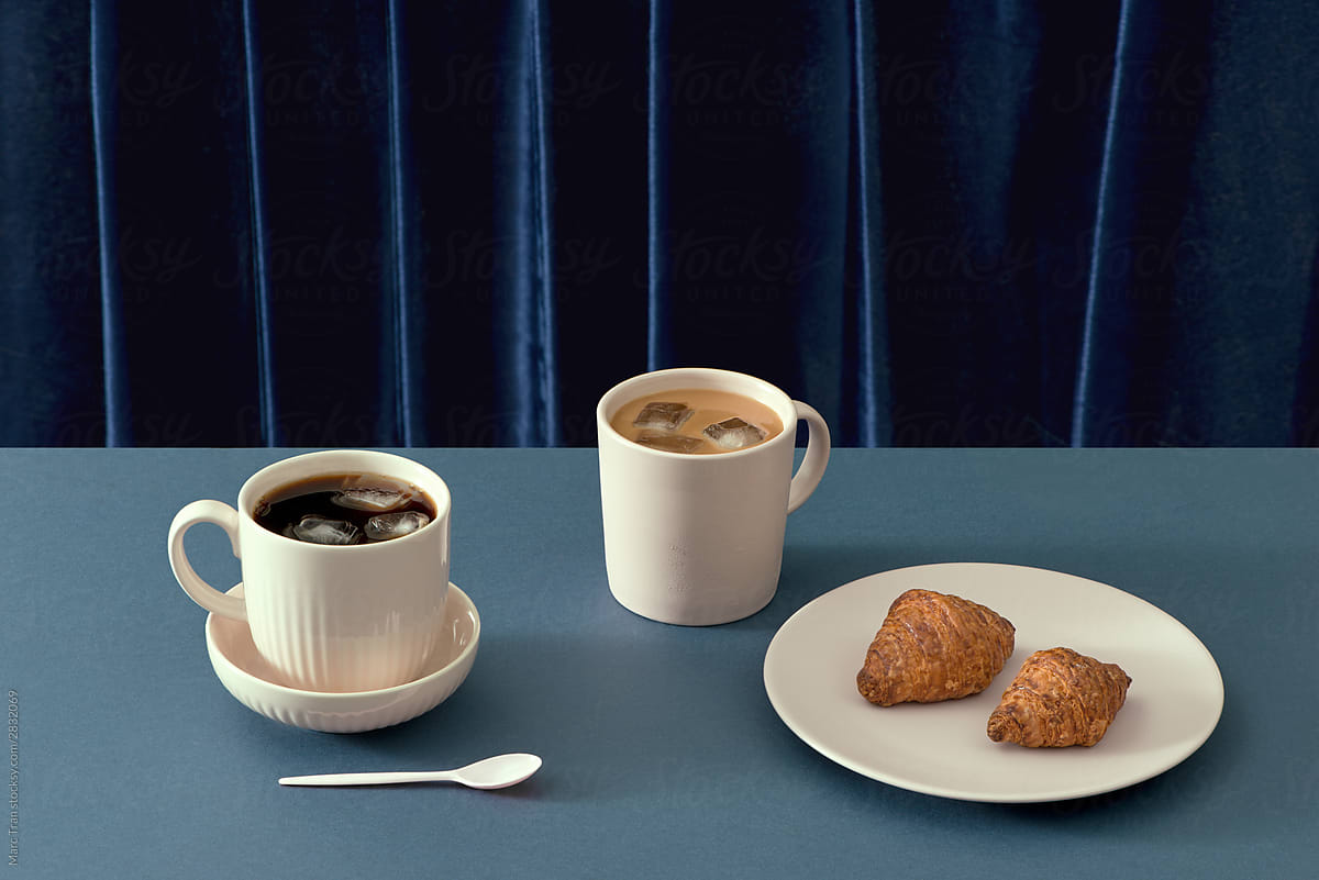 Coffee and croissant on table