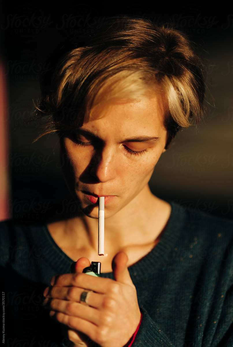 Young Androgyne Woman smoking