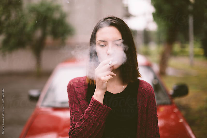 portrait of real young smoking woman
