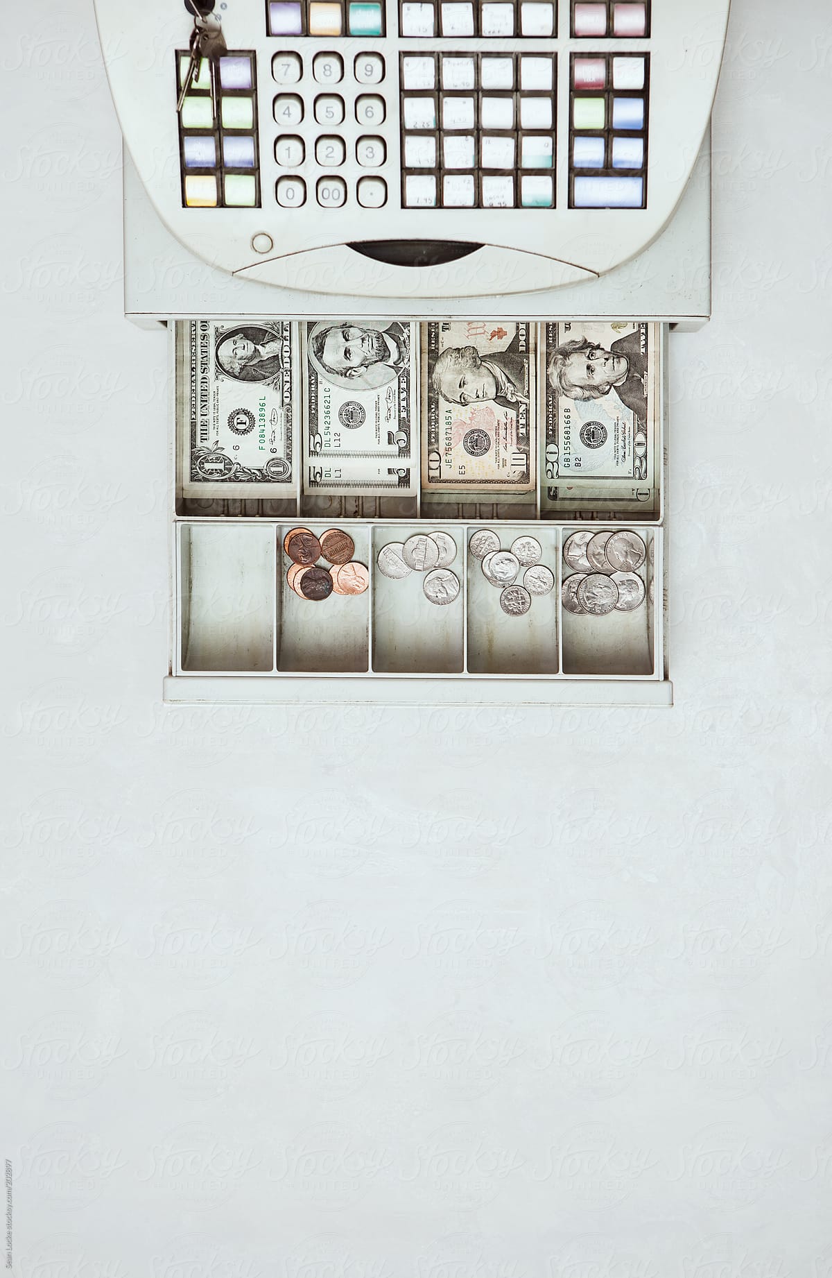 Money: Overhead View Of Cash Register And Open Drawer
