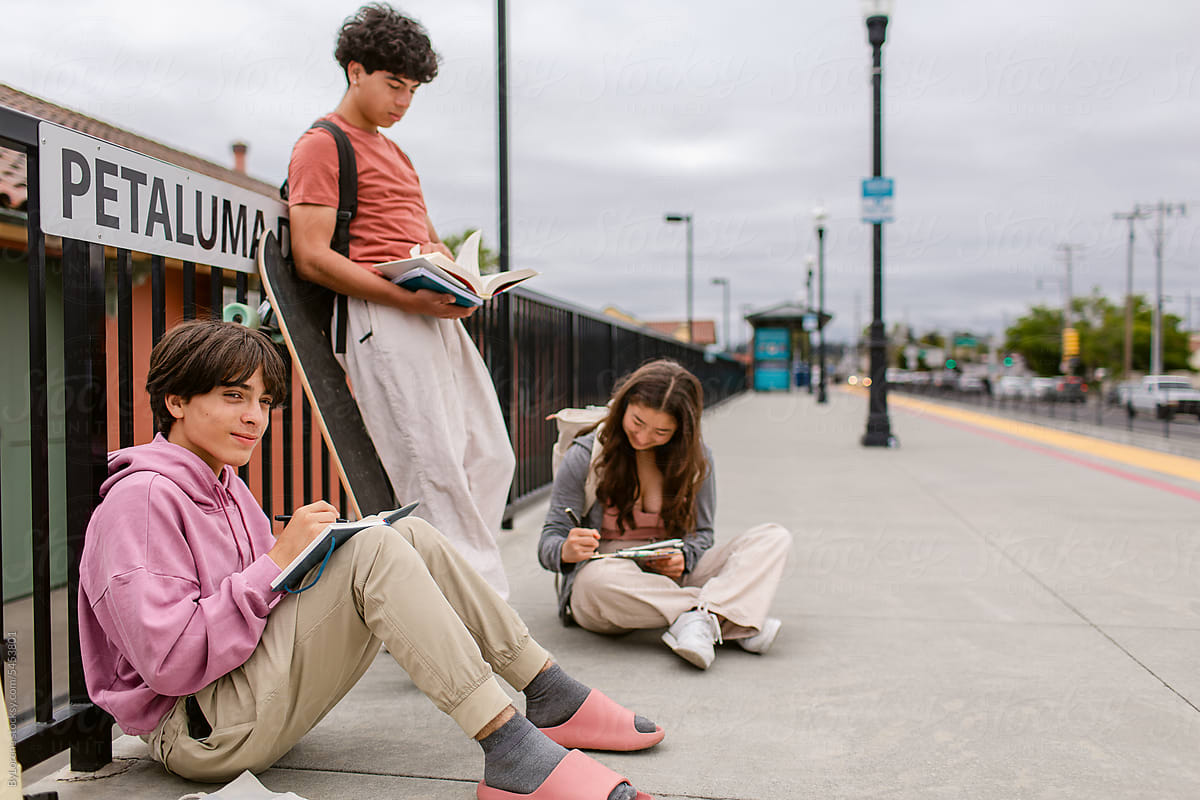 Teen studens waiting for the train at station