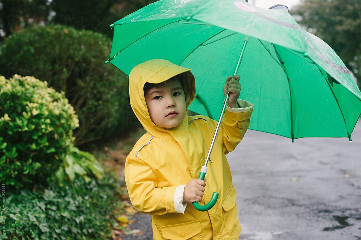Kid playing in the rain