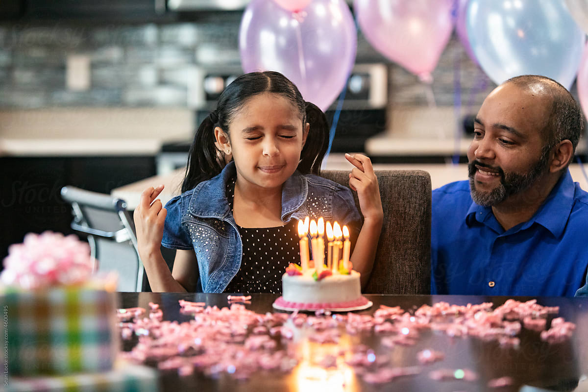 Girl Makes Birthday Wish With Eyes Closed