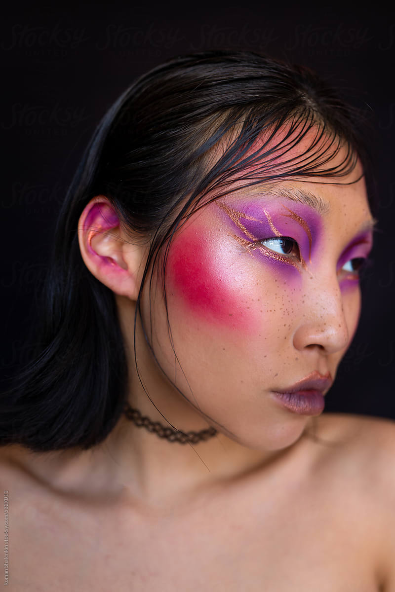 Bare woman with fashion pink makeup