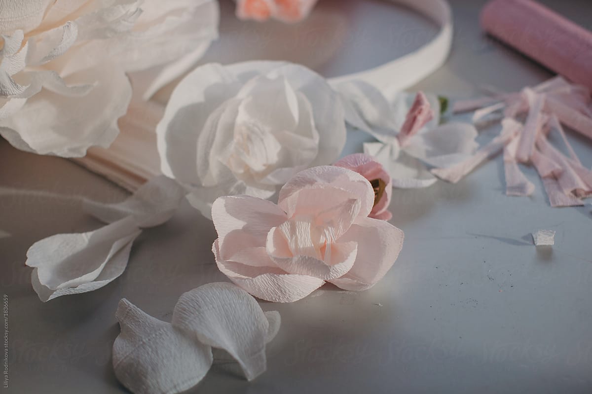 Messy table of an artist creating paper flowers