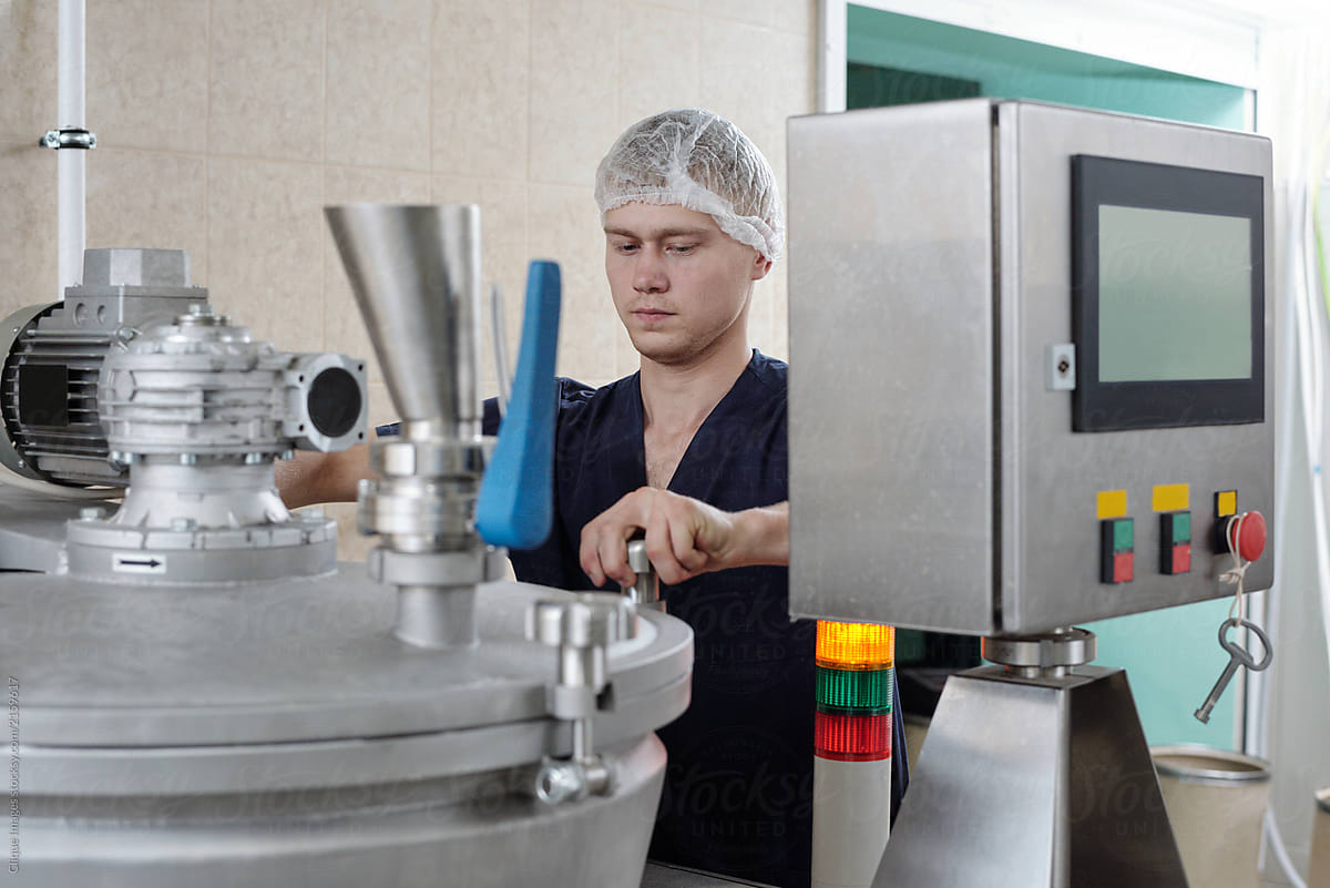 Worker Operating Food Processing Machine