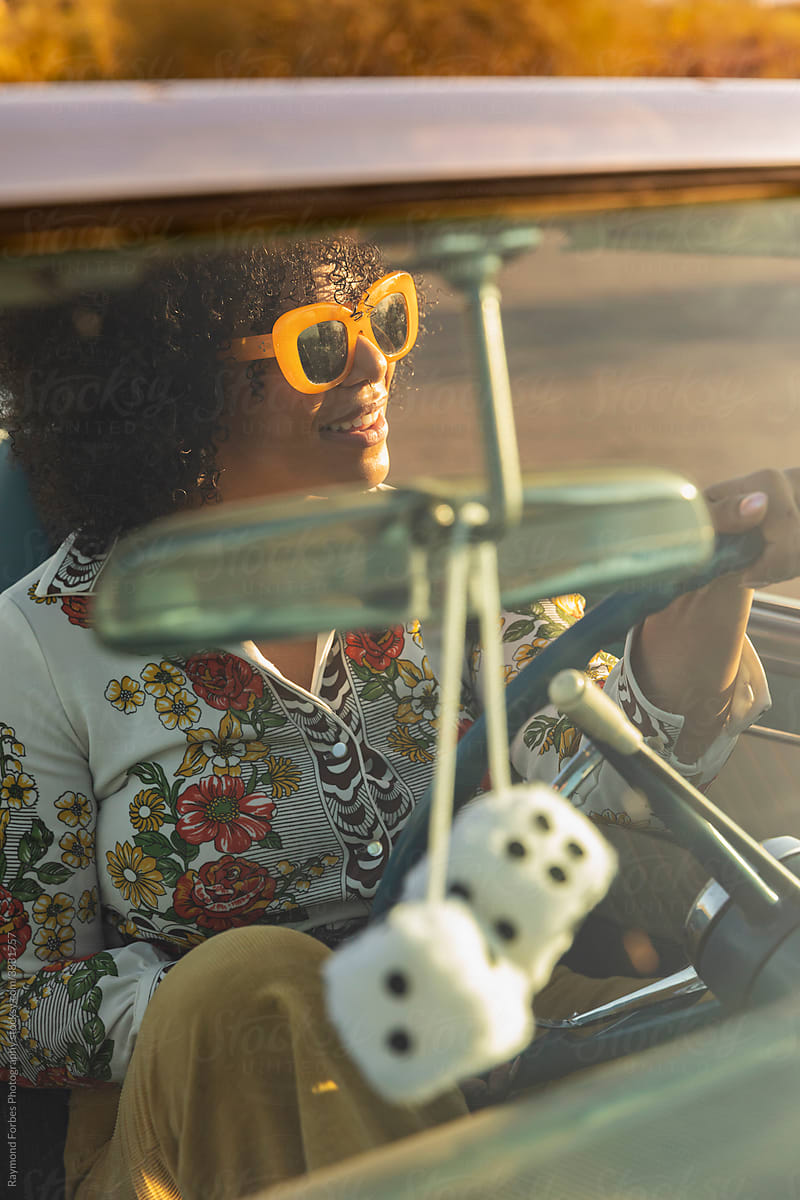 Stylish Beautiful African American woman in Vintage Car