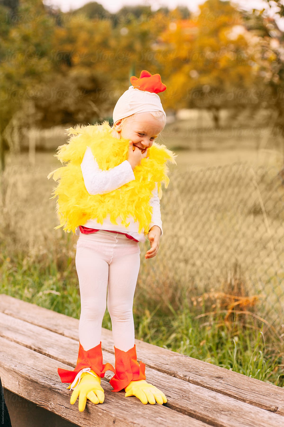 toddler laughing in a chicken costume