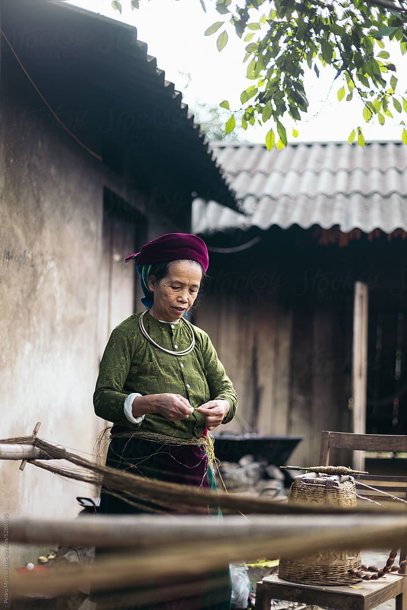 Hmong woman weaving in a workshop in the countryside